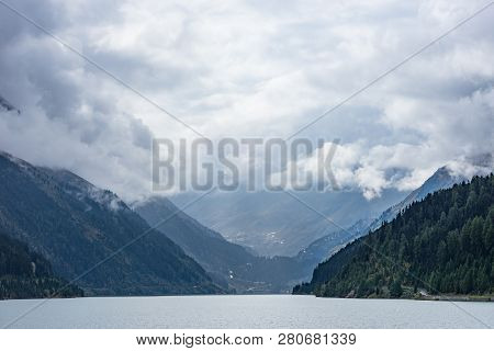 Mountains, Peaks, Lake, Everlasting Ice And Trees Landscape. Kaunertaler Gletscher Natural Environme