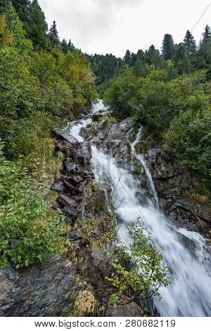 Mountain River And Trees Landscape. Kaunertaler Gletscher Natural Environment. Hiking In The Alps, K