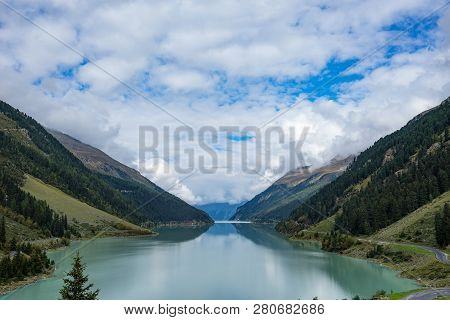 Mountains, Peaks, Lake, Everlasting Ice And Trees Landscape. Kaunertaler Gletscher Natural Environme