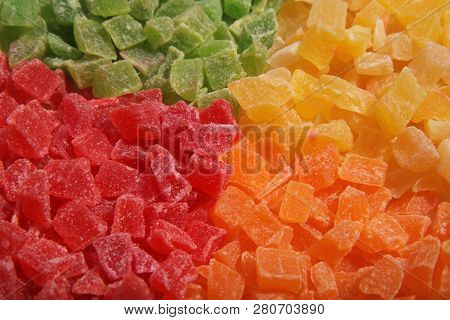 Pineapple Slices On The Plate. Four Colours Separately. Candied Fruit.