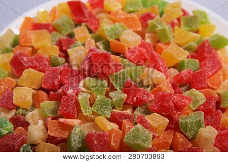 Pineapple Slices On The Plate. Four Colours Mixed. Candied Fruit.