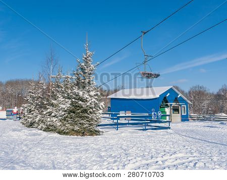 Skiers And Snouborders On A Ski Lift Pov In Winter Time. The Cable Car Lifts The Peoples Up To The S