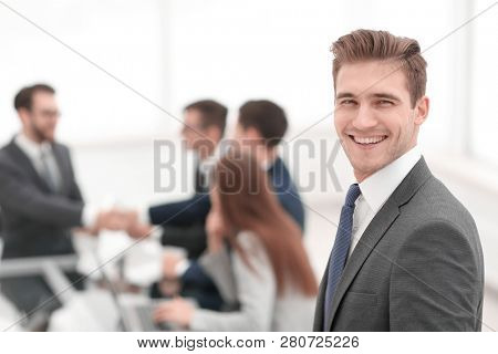 Business partners shaking hands over business objects on workpla