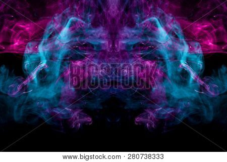 Thick Colorful Bkue And Pink Smoke  In The Form Of A Butterfly On A Black Isolated Background. Backg