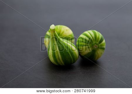 Fresh Figs Bordissot Negra Rimada Tree, Producting Its Variegated And Colorful Fruits On Dark Rustic