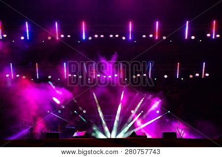 Stage Lights. Several Projectors In The Dark. Multi-colored Light Beams From The Stage Spotlights On