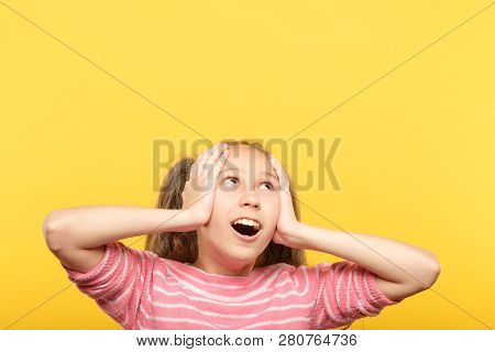 Speechless Dumbstruck Shocked Gasping Little Girl Looking Up Grasping Head With Hands. Empty Space F