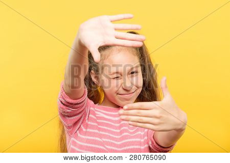 Girl Pretending To Take A Picture Through Her Hands Creating A Virtual Photo Frame. Arts Hobby And L