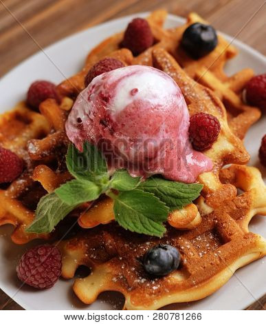 Belgian waffles with fresh berries and ice cream 