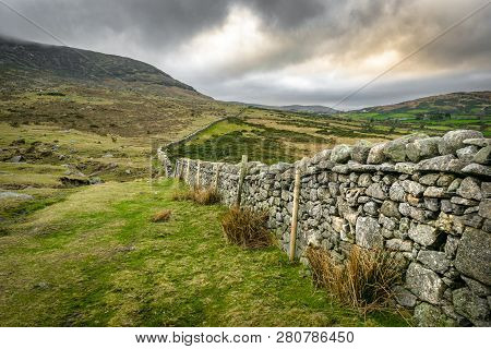 This Is A Stone Wall Running Up The Mourne Mountains In Northern Ireland.  It Is Near Hares Gap.
