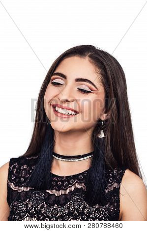 Closeup Portrait Of A Beautiful Young Oriental Girl With Beauty Makeup, Who Sincerely Smiles. Isolat
