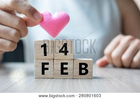 Woman Holding Pink Heart Shape Decoration Iwith Wooden Cube On Table Background. Love, Wedding, Roma