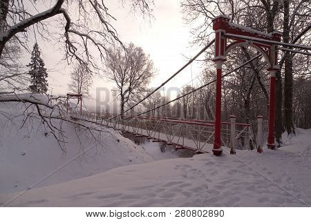Suspension Bridge Over The Valley In Park