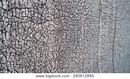 A Lot Of Small Cracks On A Gray Background