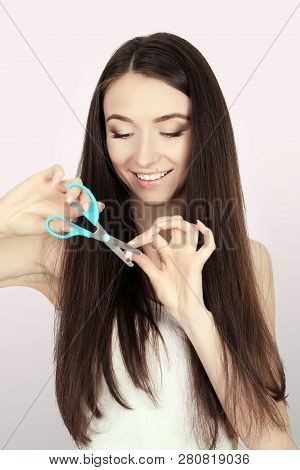 Stop Smoking Concept. Young Woman Cut Cigarettes With Scissors Happy Smiling. Focus On Hand, Scissor