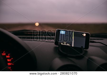 Night Road In The Car Navigator On The Phone