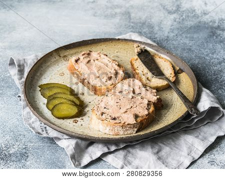 Two Toasts Duck With Prunes Rillettes Pate On White Bread With Pickled Cucumber Slices On Vintage Pl