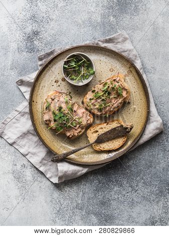 Two Toasts Duck With Prunes Rillettes Pate On White Bread With Sprouts And Various Seeds On A Vintag