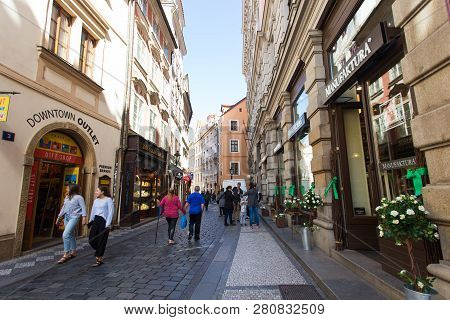 Prague, Czech Republic - June 7, 2017: Tourists Pass By Shops And Cafes In A Picturesque Section Of 