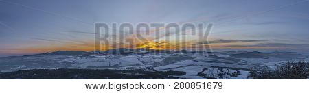 Sunrise On Boren Hill Near Bilina Town In Winter Frosty Color Morning