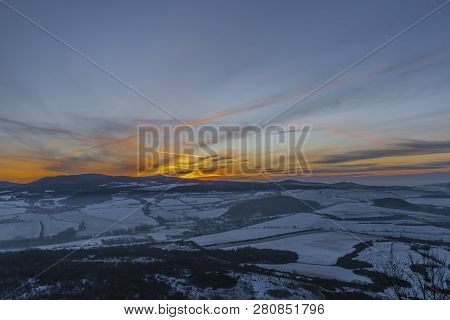 Sunrise On Boren Hill Near Bilina Town In Winter Frosty Color Morning