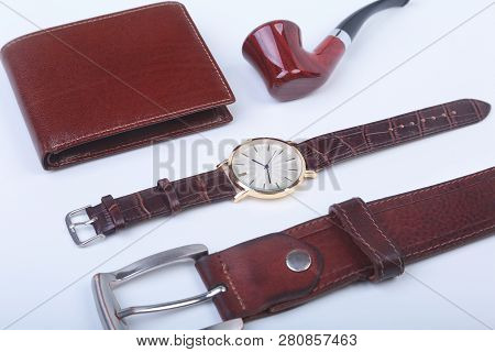 Mens Accessories For Business And Rekreation. Leather Belt, Wallet, Watch And Smoking Pipe On White 