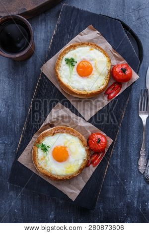 Round Khachapuri On Black Woden Cutting Board, Top View