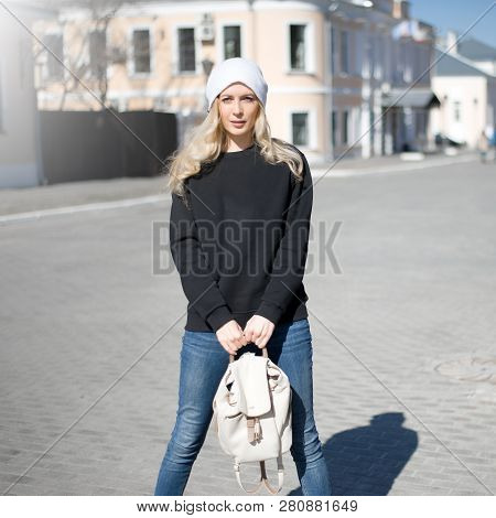 Street Fashion Look. Beautiful Girl In Black Hoody