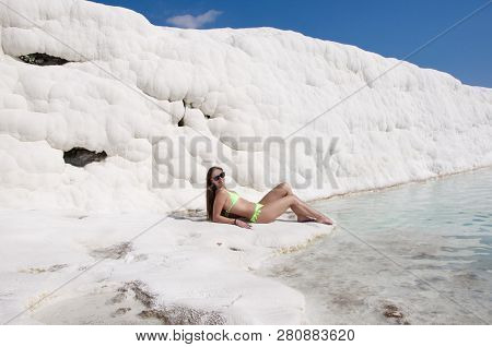 Stress Removing. Natural Travertine Pool Terrace In Pamukkale. Sexy Woman With Fit Suntan Body. Cott