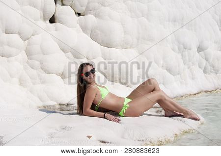 Spending Time At Spa. Sexy Woman With Fit Suntan Body. Natural Travertine Pool Terrace In Pamukkale.