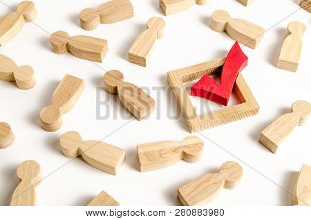 Red Tick Stands In The Middle Of The Lying Figures Of People. Voting And Election Concept. Referendu