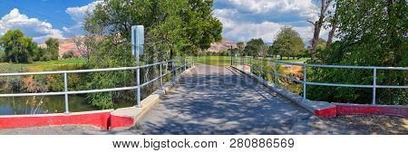 Views Of Jordan River Trail Pedestrian And Train Track Bridge With Surrounding Trees, Russian Olive,