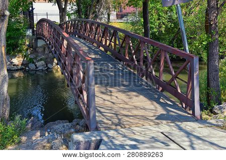 Views Of Jordan River Trail Pedestrian And Train Track Bridge With Surrounding Trees, Russian Olive,