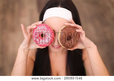Beauty Fashion Model Girl Taking Sweets And Colorful Donuts. Funny Joyful Styled Woman With Sweets O