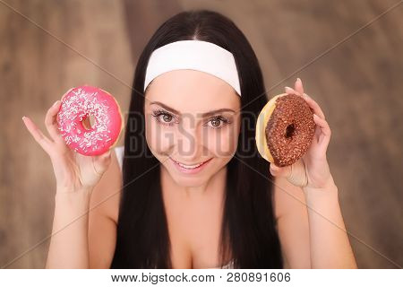 Beauty Fashion Model Girl Taking Sweets And Colorful Donuts. Funny Joyful Styled Woman With Sweets O