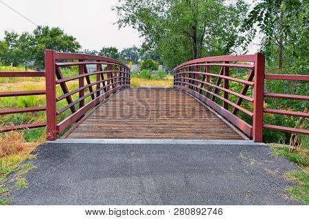 Views Of Jordan River Trail Pedestrian And Train Track Bridge With Surrounding Trees, Russian Olive,