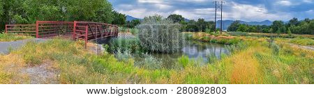 Views Of Jordan River Trail Pedestrian And Train Track Bridge With Surrounding Trees, Russian Olive,