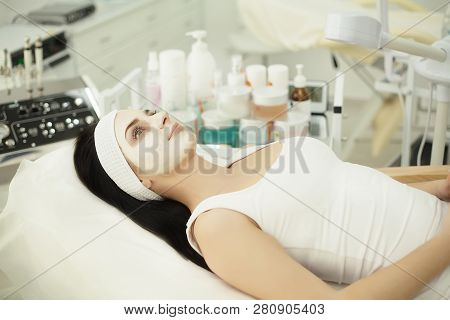 Girl At Spa Salon. Beautician Applying White Cosmetic Powder