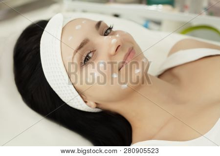 Girl At Spa Salon. Beautician Applying White Cosmetic Powder