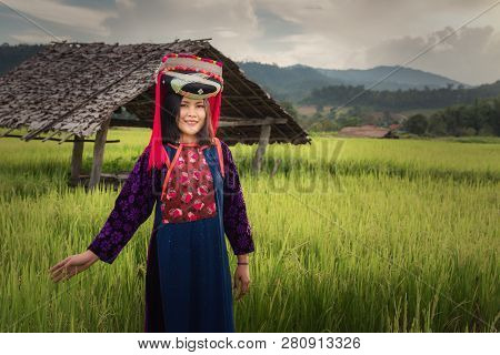 Portrait Of Woman Tribal Lisu In Traditional Dress And Jewelry Costume In Rice Fields., Lifestyle Of