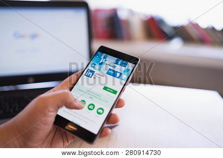 Chiang Mai, Thailand - June 03,2018: Man Holding Huawei Mobile Phone With Linkedin Application On Th