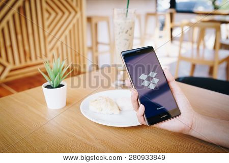 Chiang Mai, Thailand - Jan. 19,2019: Woman Holding Huawei With Dropbox On Screen. Dropbox Is A Servi