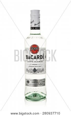 Bottle of superior white rum Bacardi Carta Blanca on a white background with reflection.