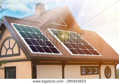 Solar Panels Installed And In Use On Roof Of Home. Reflecion Sun