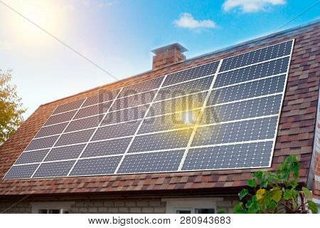 Solar Panels Installed And In Use On Roof Of Home. Reflecion Sun