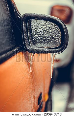 Close Up Shot Of A Frozen Car Mirror After Freezing Rain.