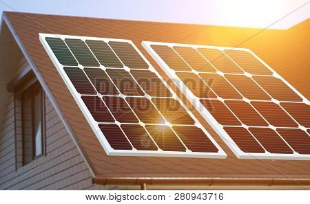 Solar Panels Installed And In Use On Roof Of Home. Reflecion Sun