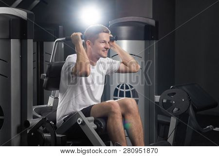 Closeup Idoor Portrait Of Ypung Attractive Fit Concentrated Sirious Sportsman In Gym. Strong Smiling