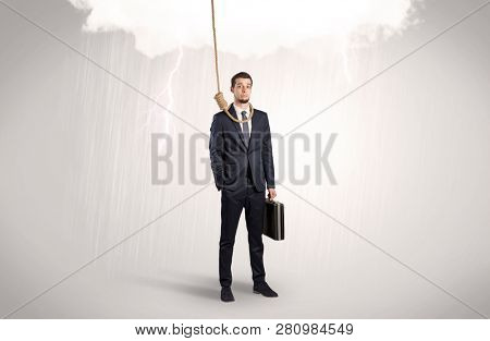 Young businessman trying to suicide with pointing hands concept