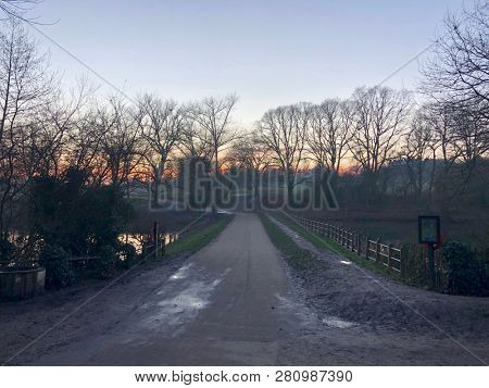 HAMPSTEAD, LONDON - JANUARY 23, 2019: Evaporation fog forms in the late afternoon as the sunsets on Hampstead Heath in Hampstead, North London, UK.